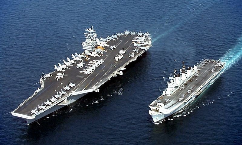 The USS Stennis, at left, and the HMS Illustrious, at right, together in the Persian Gulf in April 1998. The two ships may be sailing together again sooner than expected. Photo: Wikipedia Commons